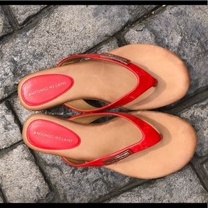 Antonio Melani orange and tan flip flop